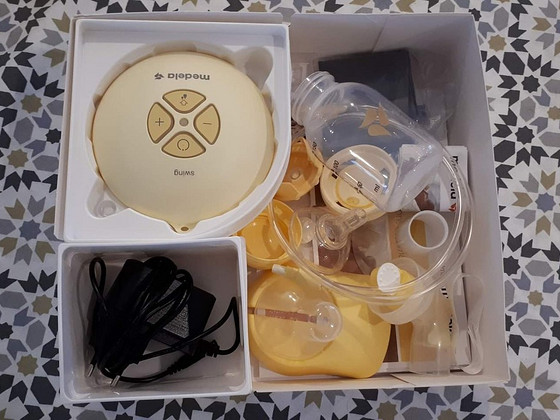 Электрический молокоотсос medela