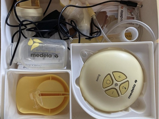 Молокоотсос Medela swing