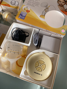 Medela электрический молокотсос, новые бутылочки и накладки (2 фото из 3)