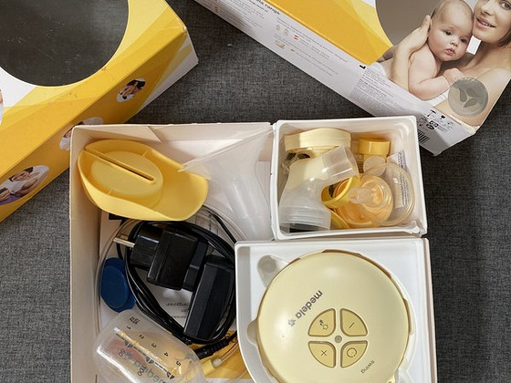 Электрический молокоотсос medela