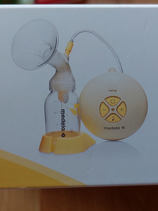 Молокоотсос medela, защитная насадка для сосков medela и сумки для хранения (1 фото из 3)