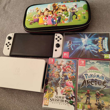 Nintendo Switch OLED + Games + Case