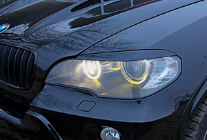 BMW X5 E70 - Uzlikas (skropstas) uz priekšējiem lukturiem (1 foto no 6)