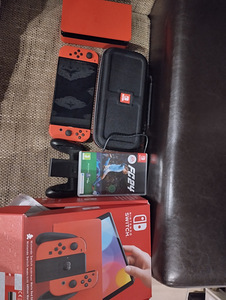 Müüa uus Nintendo Switch Oled 2 +FIFA 24 ja juhtum, on olema (1 foto / 2)