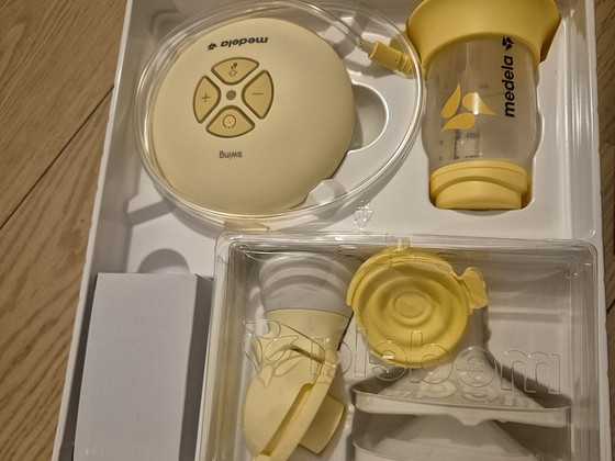 Молокоотсос Medela