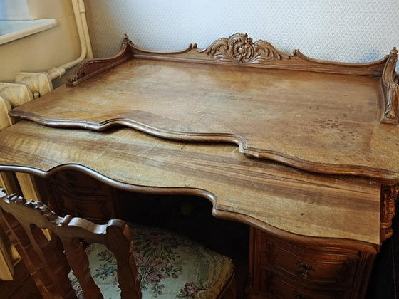 Two sets of late 19th-century antique walnut furniture.