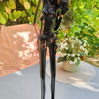 Skulptuur afrika tüdruk kivil veeanumaga. Puidust. K 58 cm,