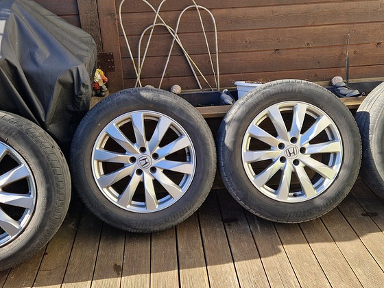 Honda CR-V R18 originaalveljed, suverehvid Bridgestone Alenz