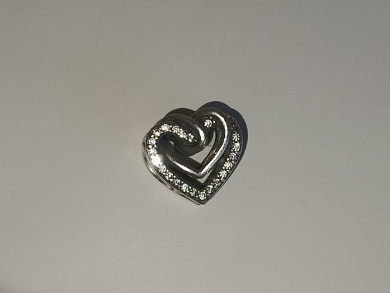 Pandora Amulett "Sädelevad põimunud südamed"
