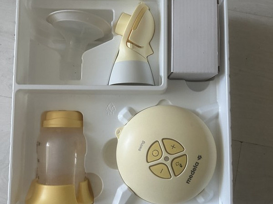 Молокоотсос Medela swing