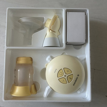 Молокоотсос Medela swing