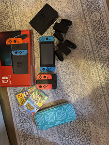 Nintendo Switch 1-го поколения + 4 Joy-Con + 2 игры (1 фото из 1)