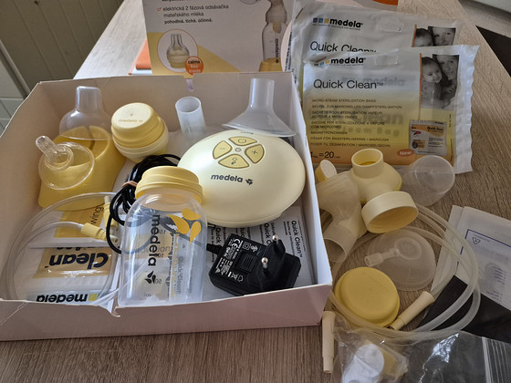 Электрический молокоотсос Medela
