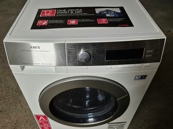 Стирально-сушильная машина AEG L87695NWD 9 кг 1600 об/мин