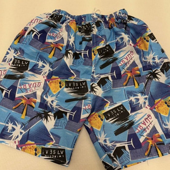 Синие плавательные шорты с тропическим узором / swim short